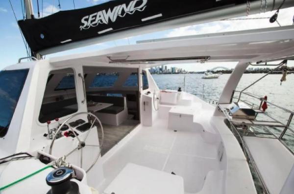 Slide: The Image of 2024 Seawind 1160 Lite catamaran with spacious deck and modern design. - 4
