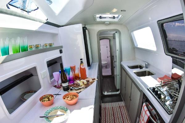 Slide: The Image of 2024 Seawind 1160 Lite yacht interior kitchen with snacks and drinks. - 48
