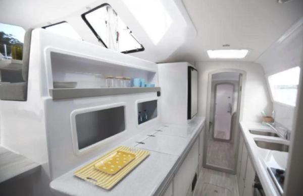 Slide: The Image of Modern interior of 2024 Seawind 1160 Lite catamaran with sleek kitchen design. - 6