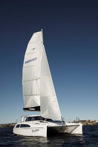 Slide: The Image of 2024 Seawind 1160 Lite sailing catamaran on open water. - 8