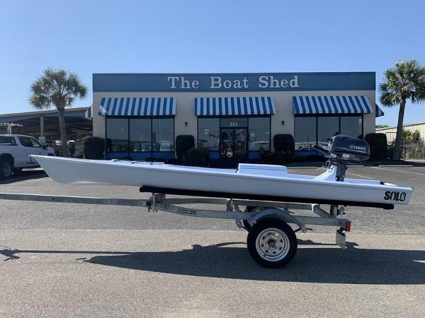 Slide: The Image of 2023 Solo Skiff 14 boat on trailer outside The Boat Shed. - 0
