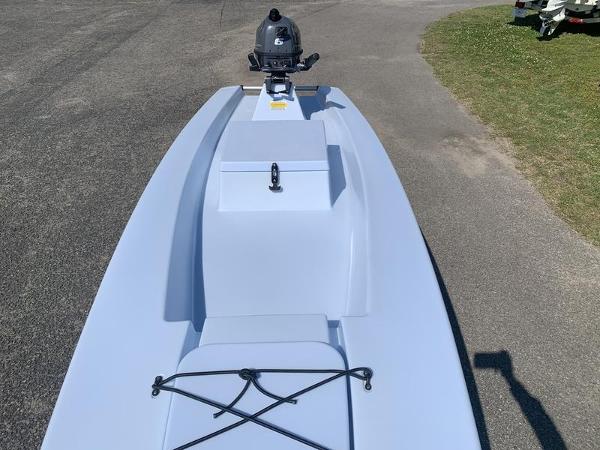 Slide: The Image of 2023 Solo Skiff 14 with outboard motor on paved surface. - 7