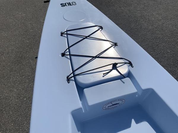 Slide: The Image of 2023 Solo Skiff 14 with bungee cord storage on deck. - 9