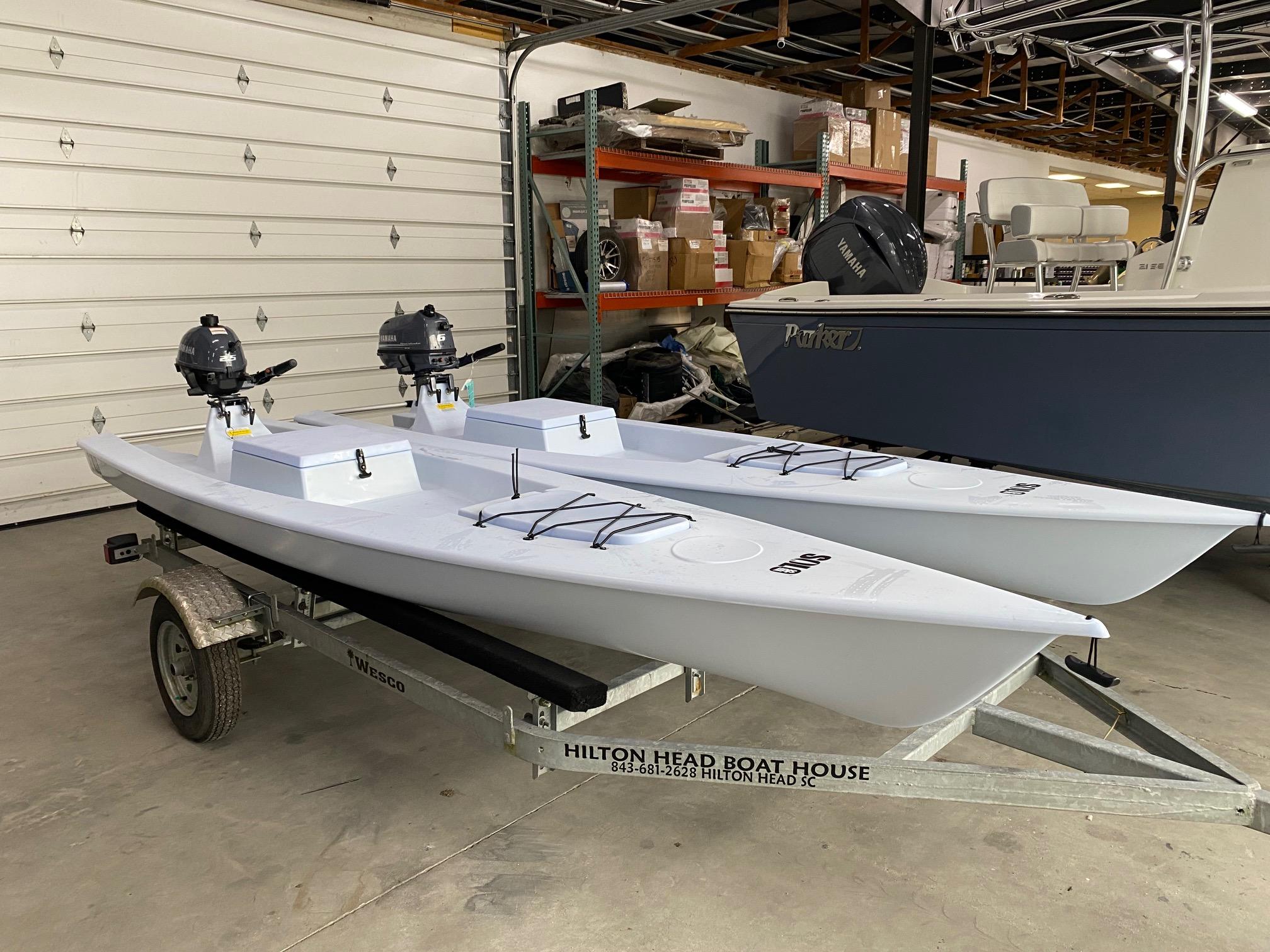 Slide: The Image of 2023 Solo Skiff boats on trailer in indoor storage. - 1