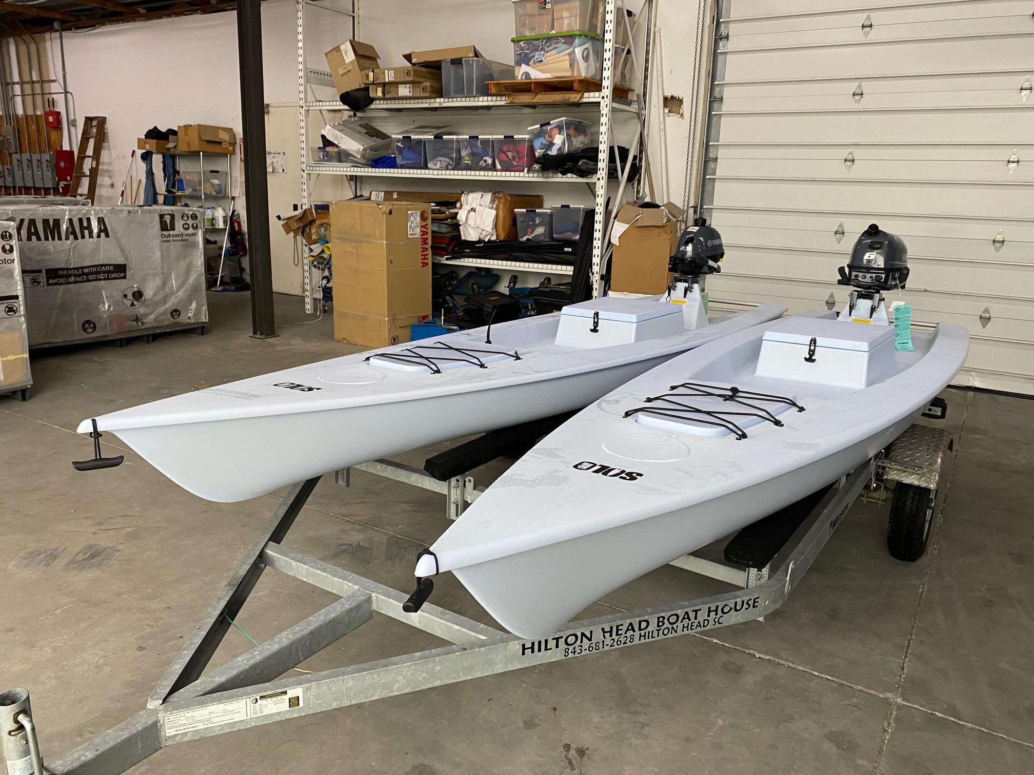 Slide: The Image of 2023 Solo Skiff boats in a garage, on a trailer, ready for use. - 4