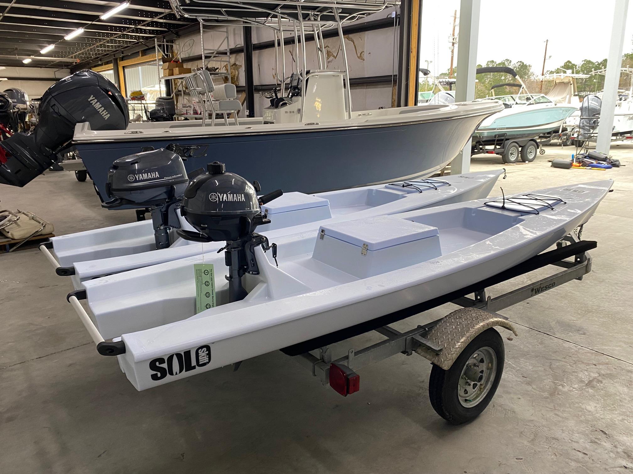 Slide: The Image of 2023 Solo Skiff boats with Yamaha motors in a showroom. - 6