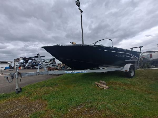 Slide: The Image of 2022 Starweld 19' FLEX DC boat on trailer, outdoor display. - 1