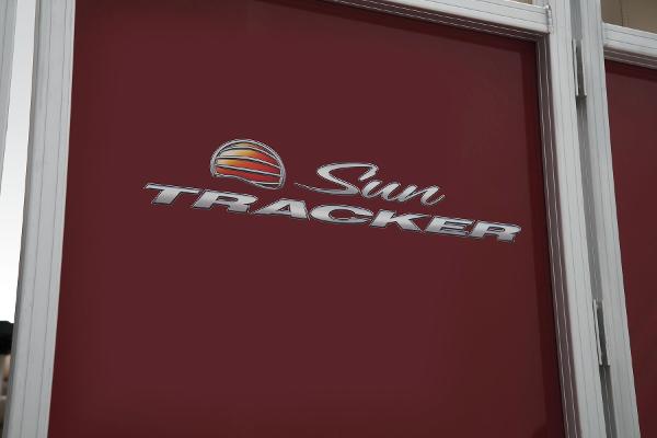 Slide: The Image of 2024 Sun Tracker Party Barge 20 DLX logo on red background. - 19