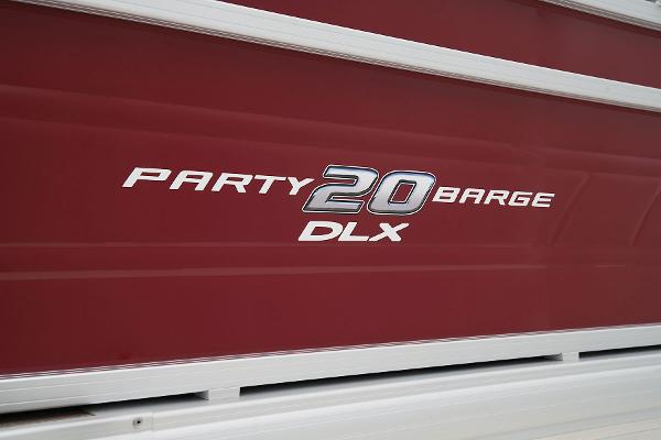 Slide: The Image of 2024 Sun Tracker Party Barge 20 DLX logo on red background. - 20