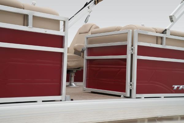 Slide: The Image of 2024 Sun Tracker Party Barge 20 DLX pontoon boat interior with red panels and beige seating. - 21