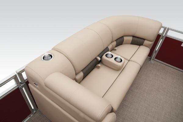 Slide: The Image of 2024 Sun Tracker Party Barge 20 DLX seating area with cup holders and beige upholstery. - 26