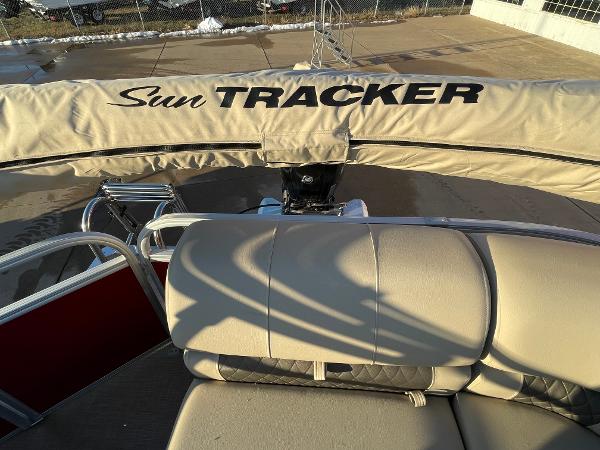 Slide: The Image of 2024 Sun Tracker Party Barge 20 DLX pontoon boat with covered engine and seating. - 4