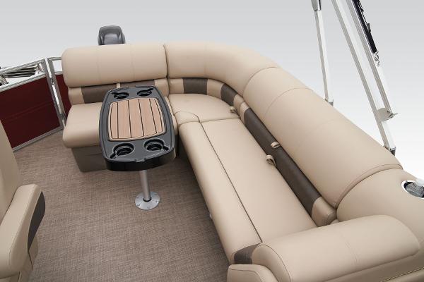 Slide: The Image of 2024 Sun Tracker Party Barge 20 DLX interior seating and table setup. - 43