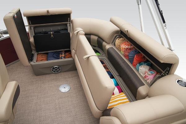 Slide: The Image of 2024 Sun Tracker Party Barge 20 DLX interior storage compartments filled with various items. - 45