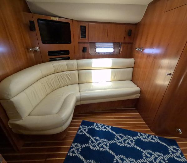 Slide: The Image of Luxurious interior of 2004 Tiara Yachts 5200 Sovran Salon with leather seating. - 13