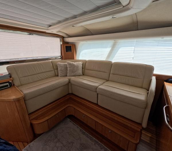 Slide: The Image of Luxurious interior of 2004 Tiara Yachts 5200 Sovran Salon with beige leather seating. - 7