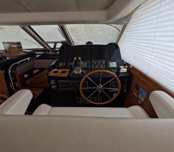Slide: The Image of Helm station of a 2004 Tiara Yachts 5200 Sovran Salon with navigation equipment. - 8