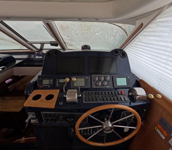 Slide: The Image of Helm station of a 2004 Tiara Yachts 5200 Sovran Salon with navigation equipment. - 9