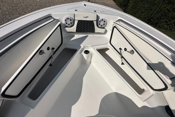 Slide: The Image of 2024 Tidewater 210 CC Adventure boat bow storage compartments and speakers. - 15