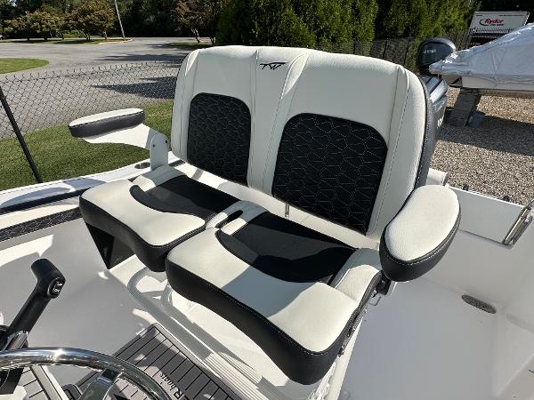 Slide: The Image of 2024 Tidewater 210 CC Adventure boat seating with black and white upholstery. - 36
