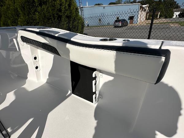 Slide: The Image of 2024 Tidewater 210 CC Adventure boat interior detail with white and black seating. - 39