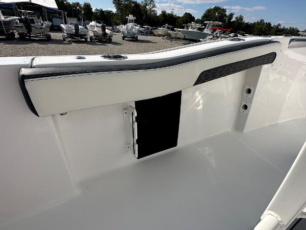 Slide: The Image of 2024 Tidewater 210 CC Adventure boat interior detail with white and black trim. - 40