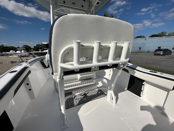Slide: The Image of 2024 Tidewater 210 CC Adventure boat interior with rod holders and seating. - 48