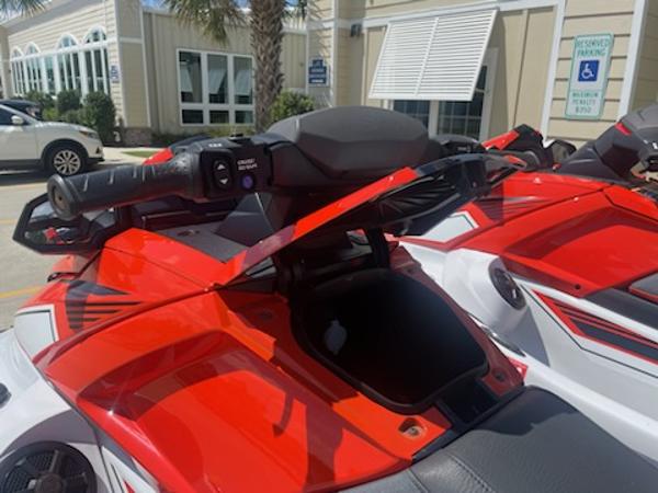 Slide: The Image of 2021 Yamaha WaveRunner VX Cruiser in red and white, parked outdoors. - 4