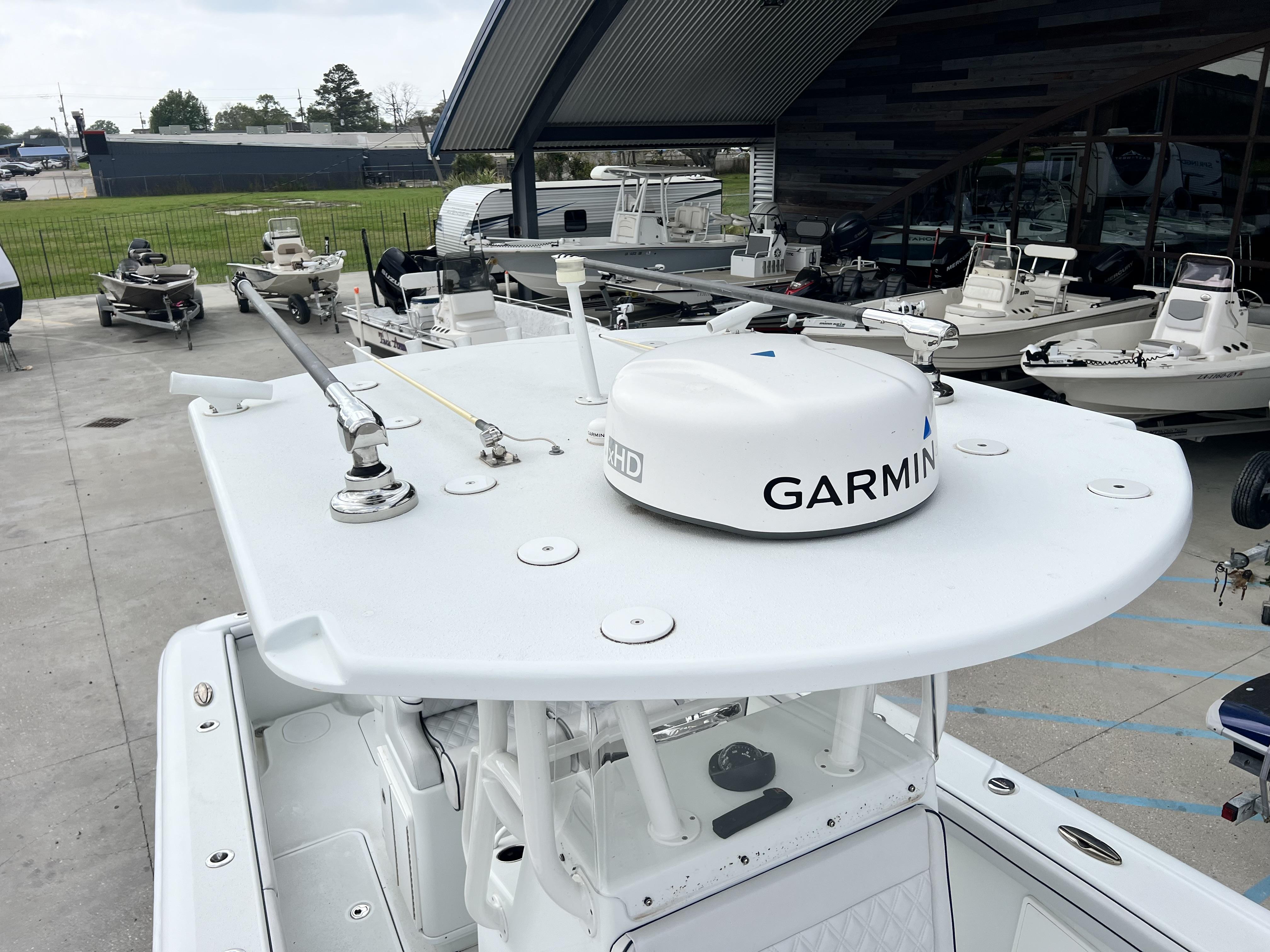 Slide: The Image of 2018 Yellowfin 29 boat with Garmin radar in a marina. - 12