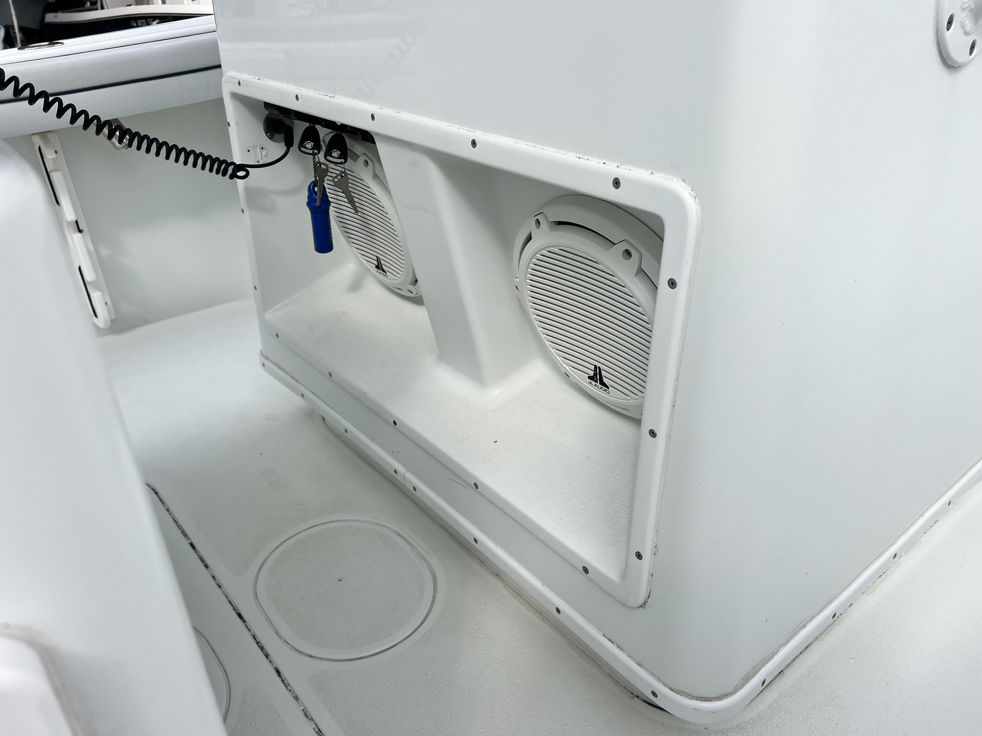 Slide: The Image of 2018 Yellowfin 29 boat interior with built-in speakers and control panel. - 15