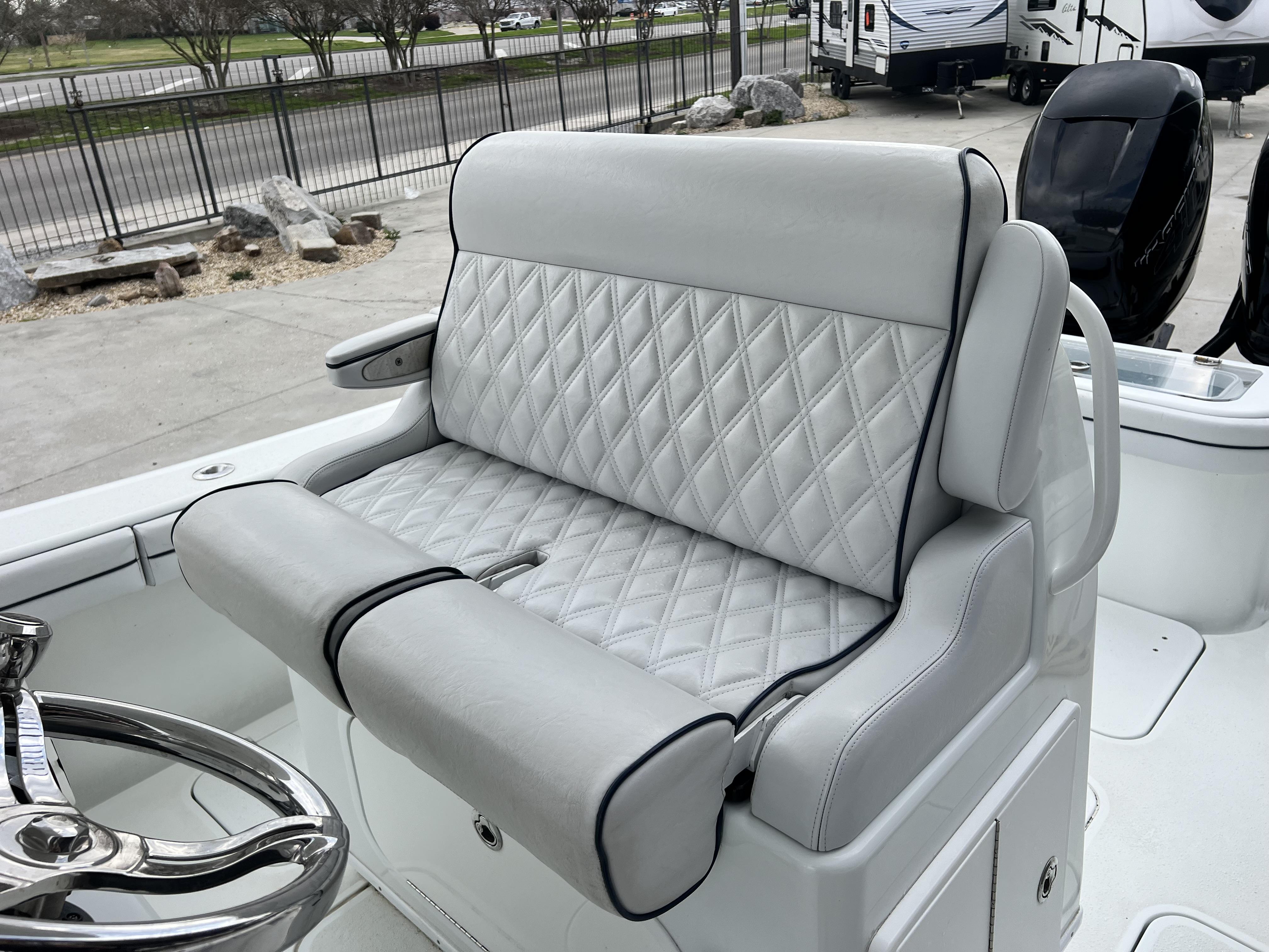 Slide: The Image of 2018 Yellowfin 29 boat with diamond-stitched white leather seating. - 17