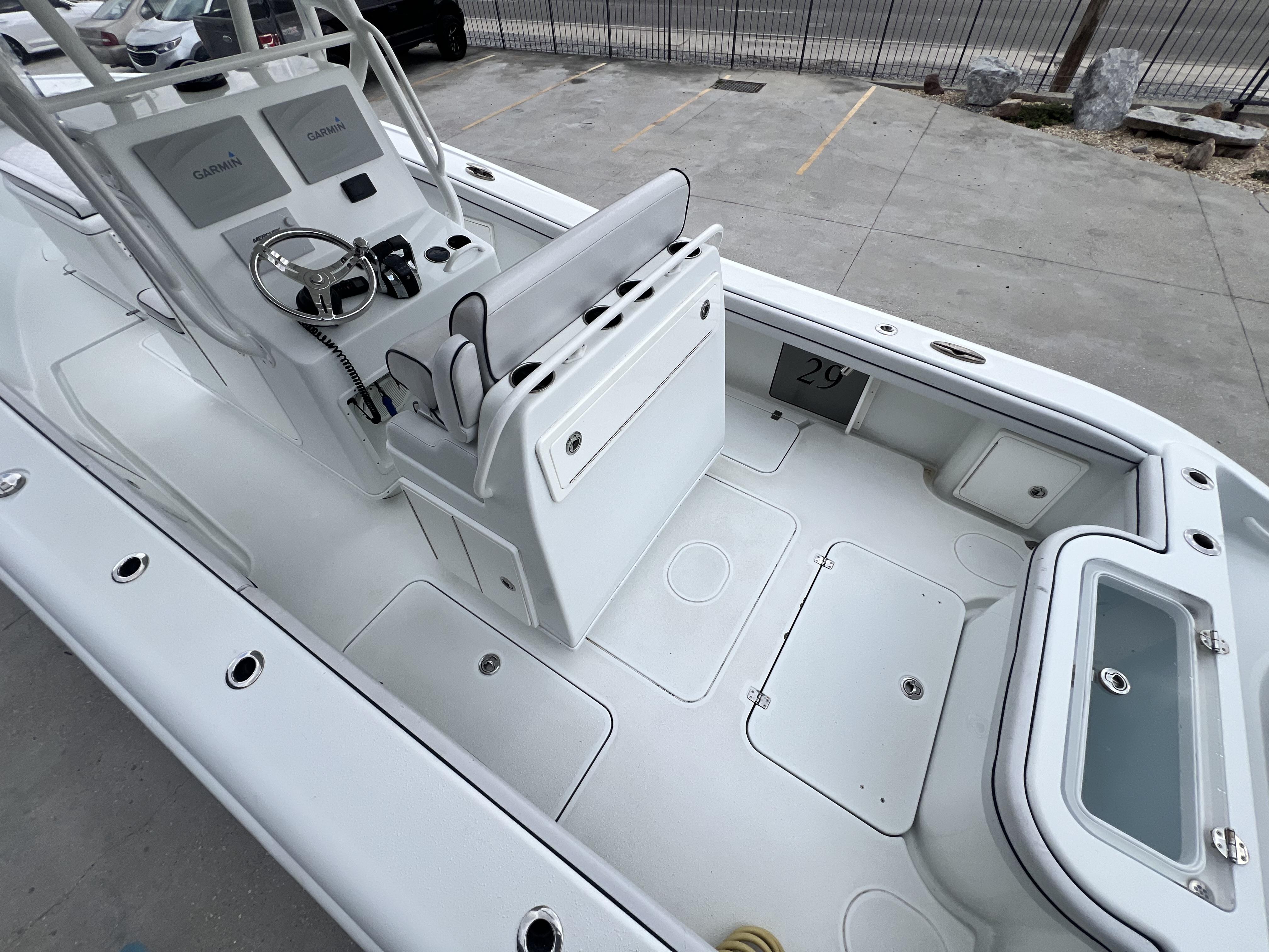 Slide: The Image of 2018 Yellowfin 29 boat interior with Garmin electronics and seating. - 18