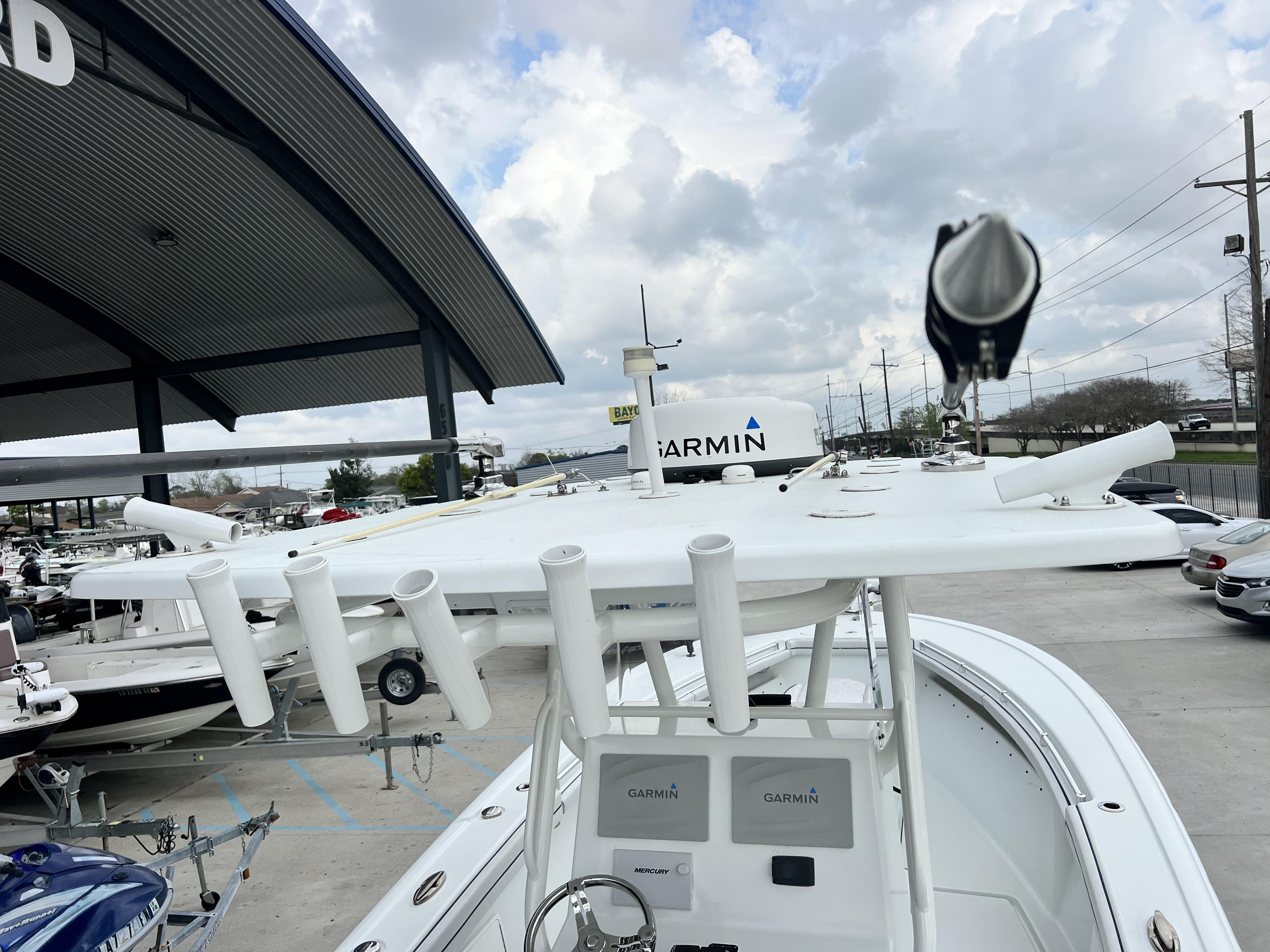Slide: The Image of 2018 Yellowfin 29 boat with Garmin electronics and rod holders. - 21