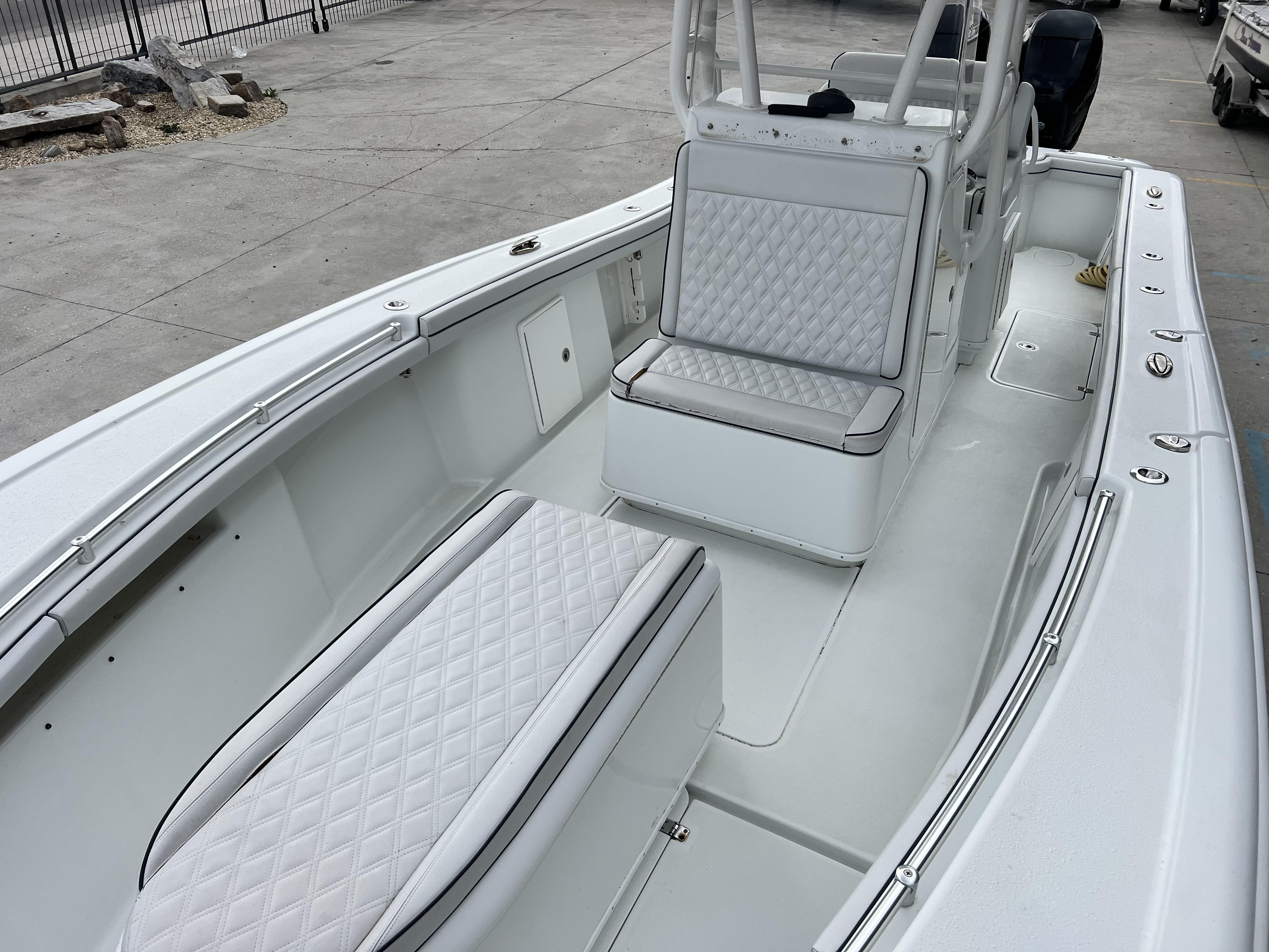 Slide: The Image of 2018 Yellowfin 29 boat with white quilted seating and spacious deck. - 28