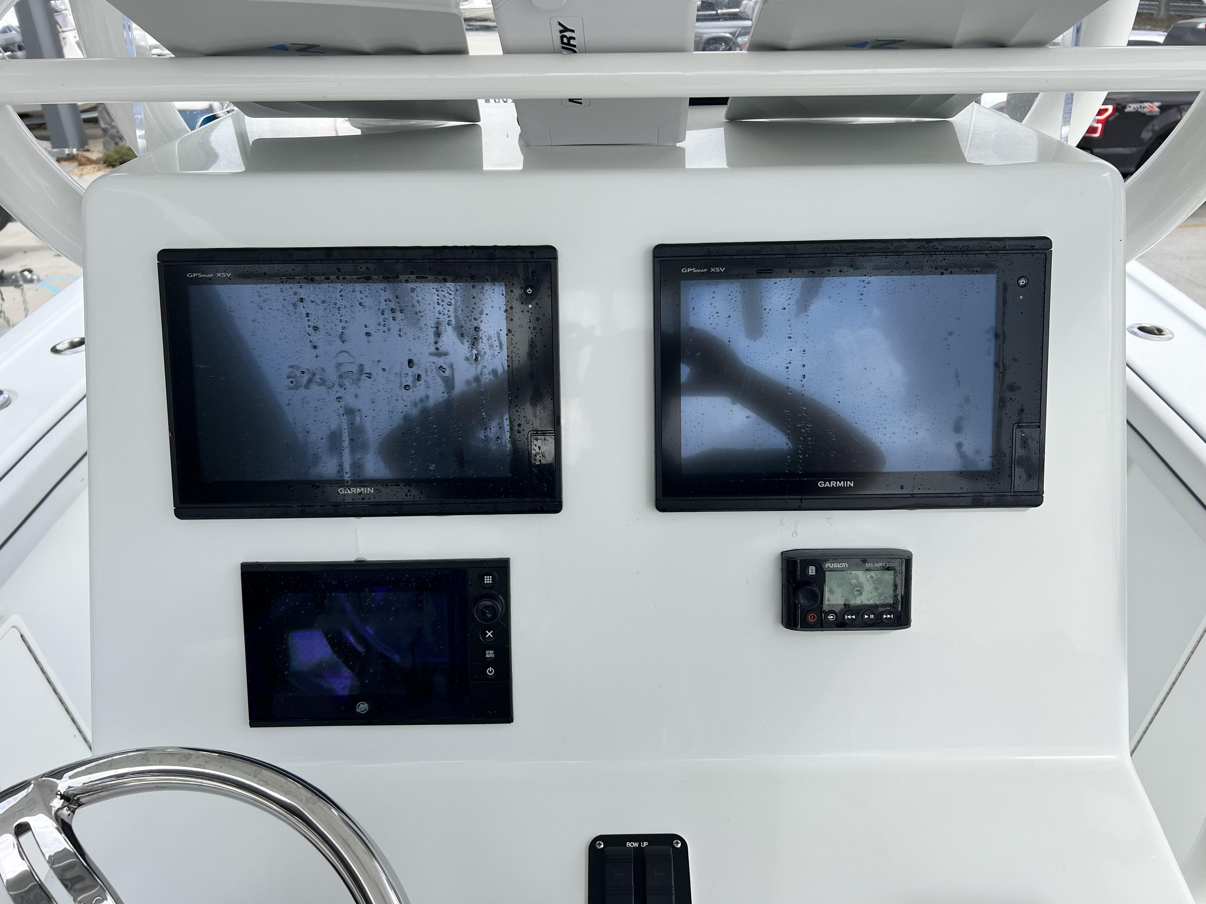 Slide: The Image of Yellowfin 29 boat console with Garmin GPS displays and Fusion marine stereo, 2018 model. - 30