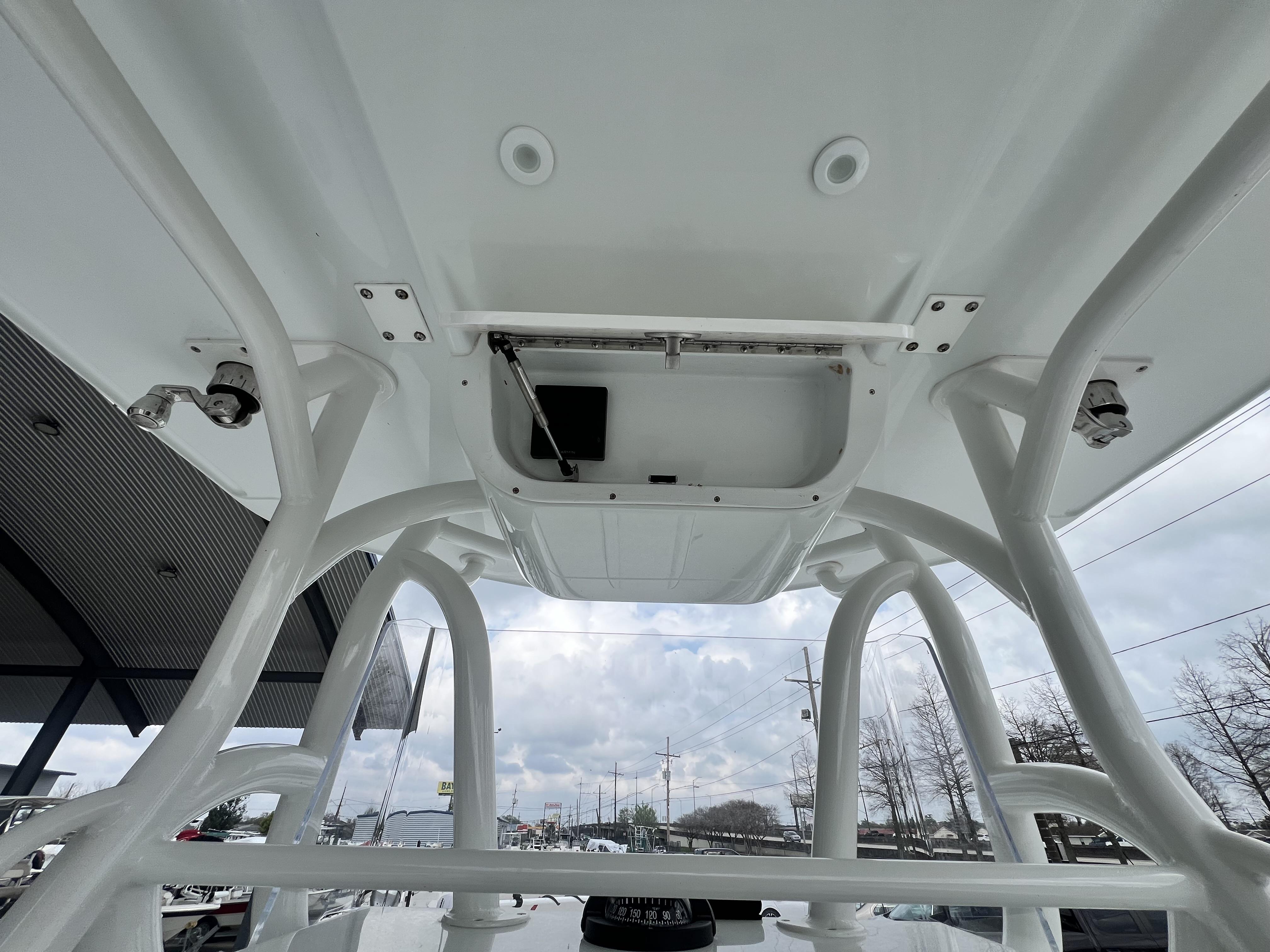 Slide: The Image of 2018 Yellowfin 29 boat's T-top structure and electronics compartment. - 32