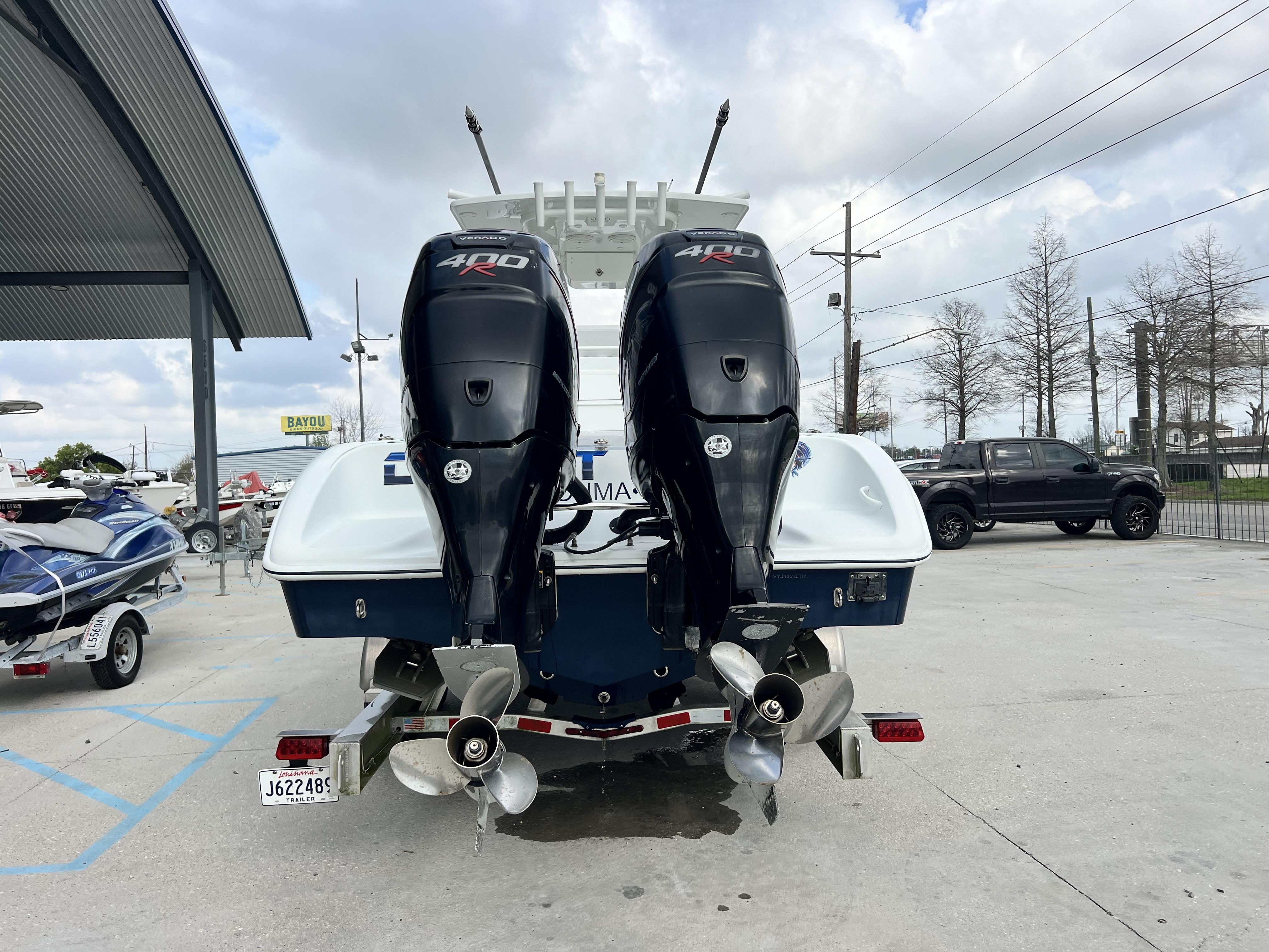 Slide: The Image of 2018 Yellowfin 29 boat with twin 400 horsepower engines at a dealership. - 4