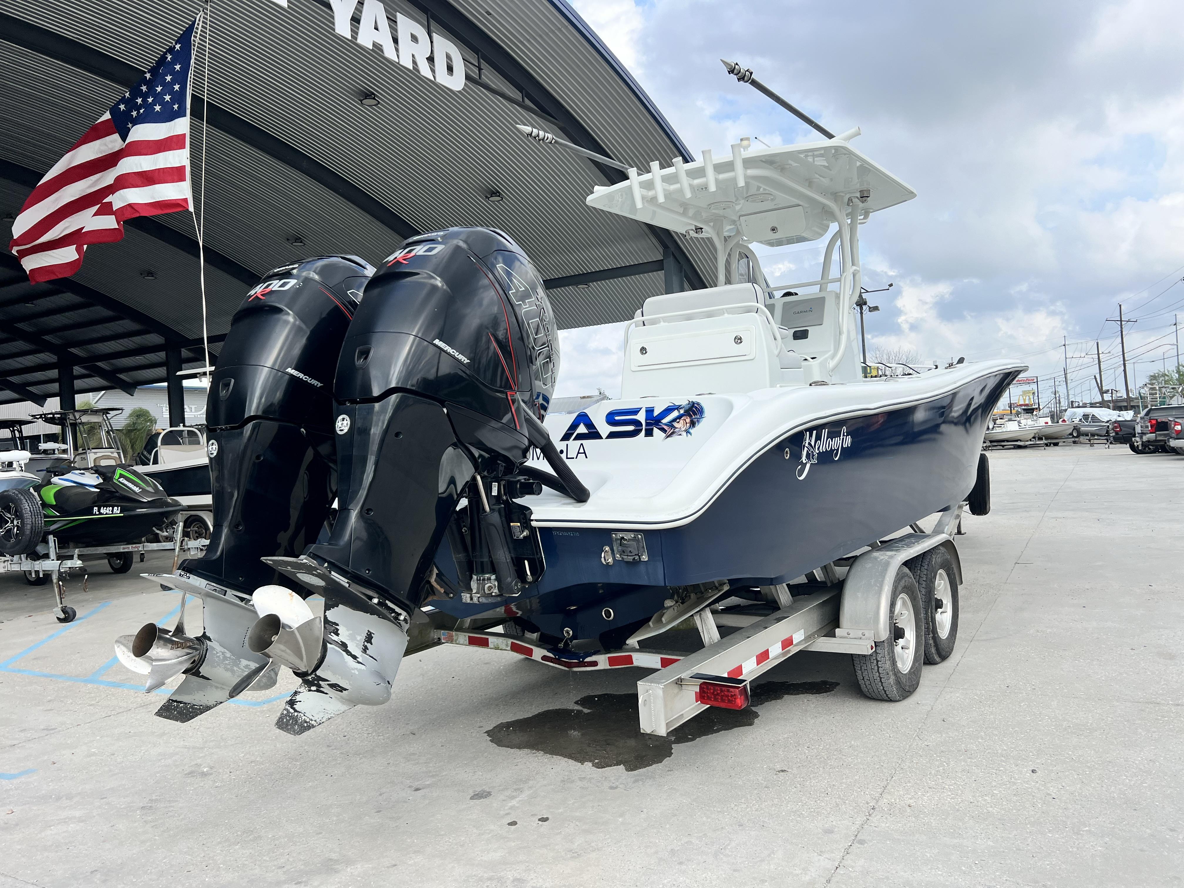 Slide: The Image of 2018 Yellowfin 29 boat on trailer with twin outboard engines at a boatyard. - 5