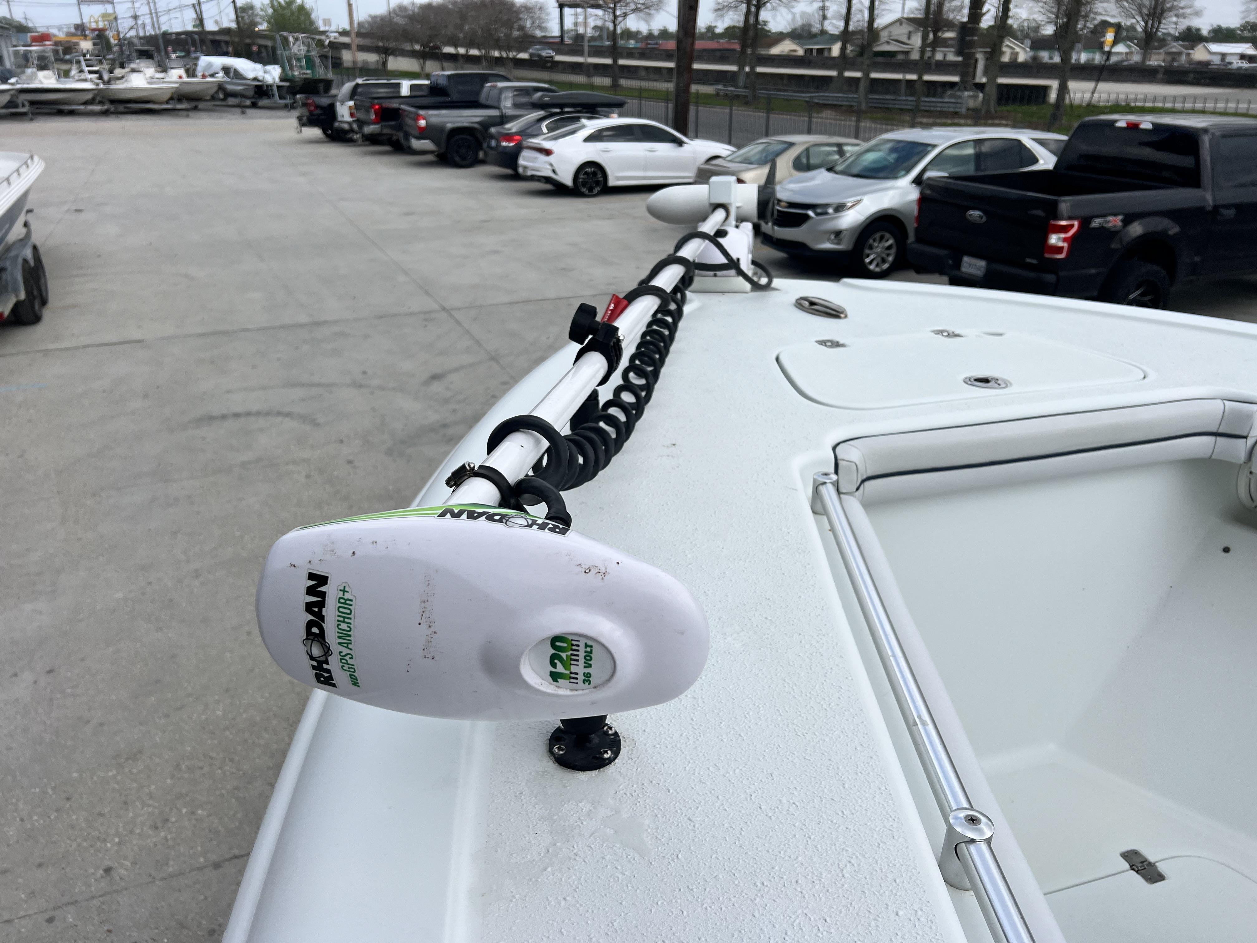 Slide: The Image of 2018 Yellowfin 29 boat with a Rhodan GPS Anchor+ motor in a parking lot. - 6