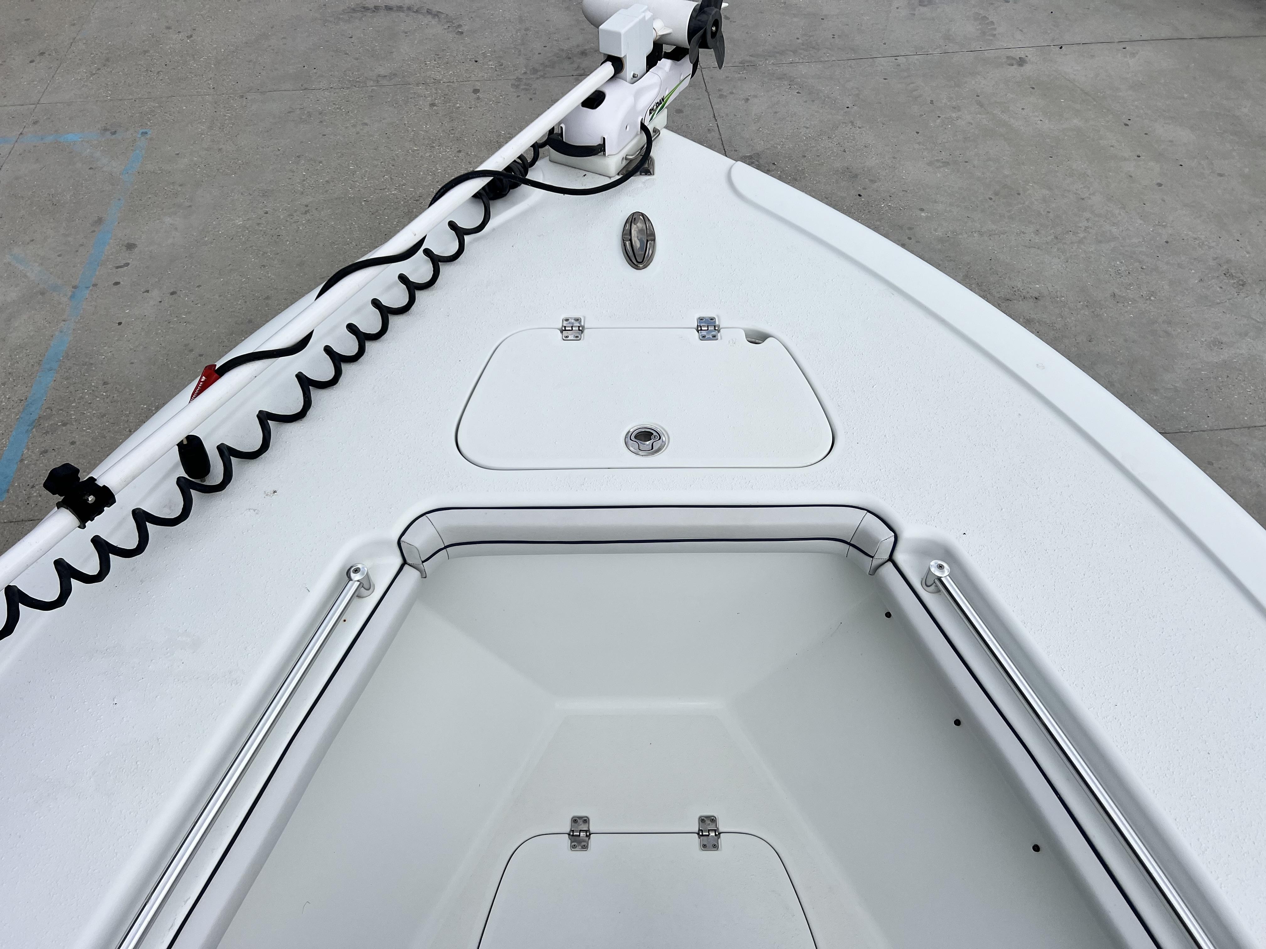 Slide: The Image of 2018 Yellowfin 29 boat bow with storage compartments and trolling motor. - 7